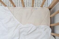 Merino quilted cot mattress padding protector – Puddle Pad